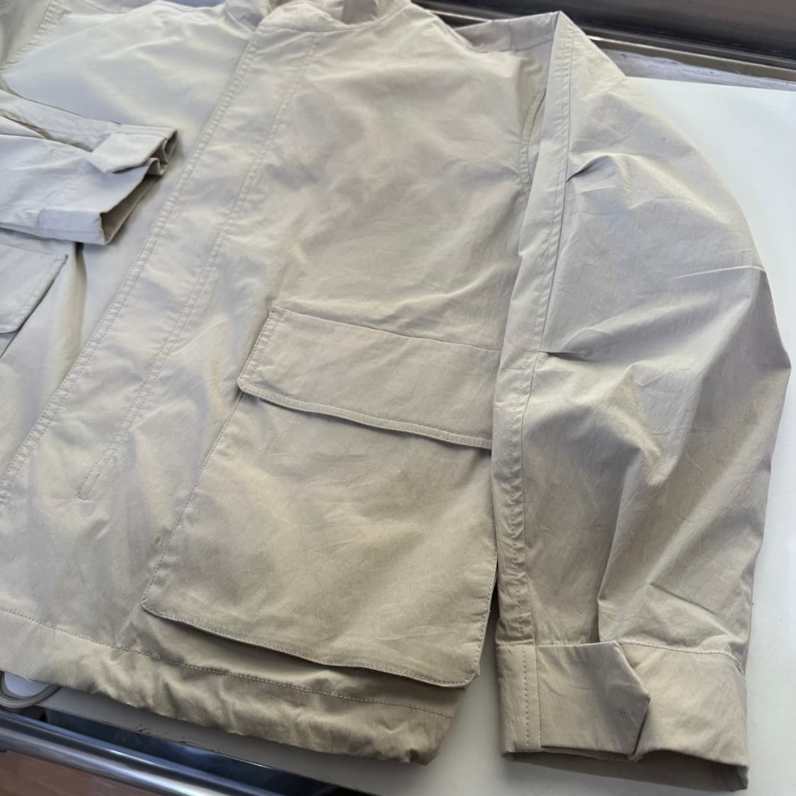 L 100 마인드브릿지 오버핏 밑단스트링 라이트베이지 나일론자켓 상품이미지2