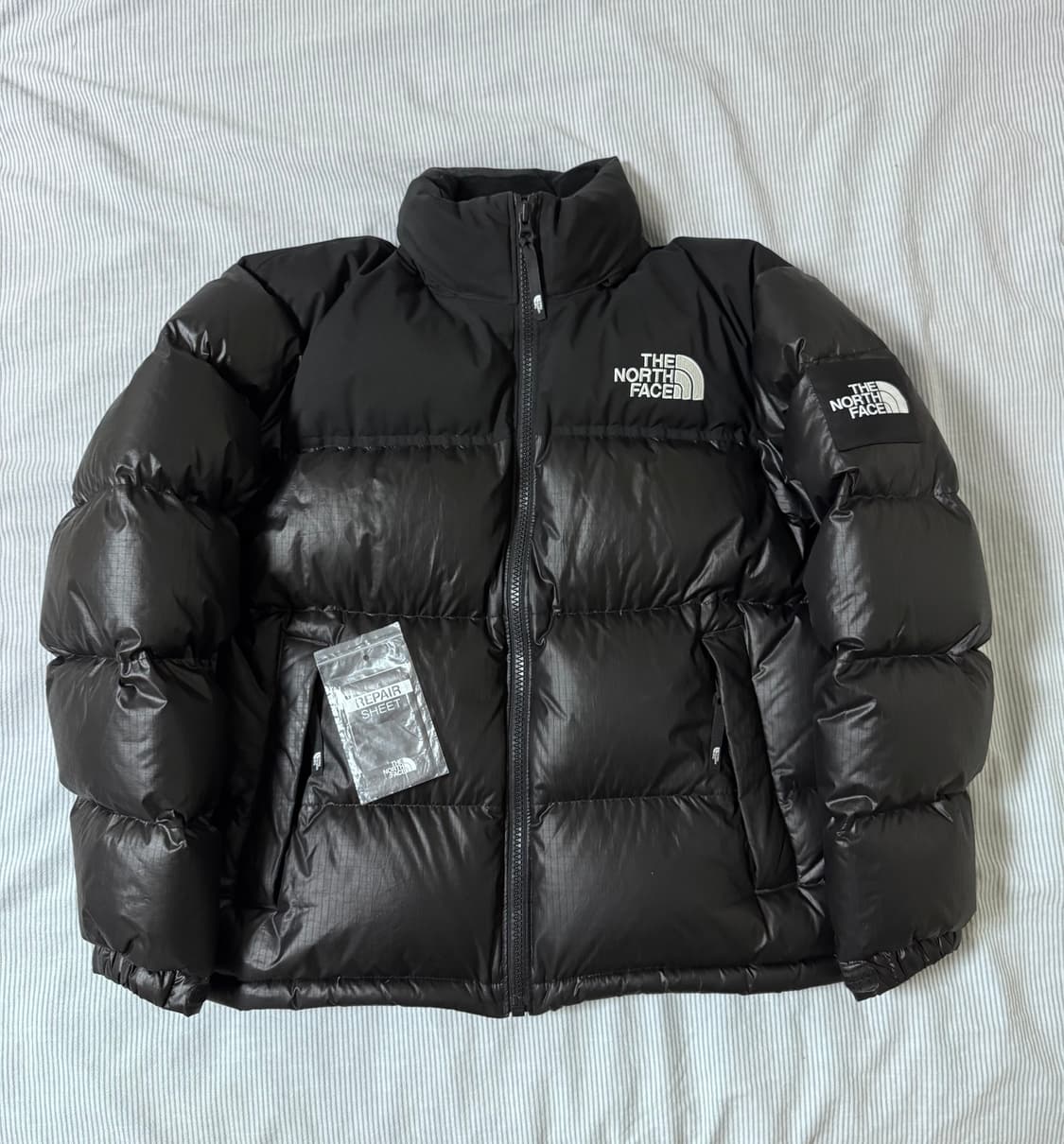 노스페이스 화이트 라벨 노벨티 눕시 다운 자켓 블랙 상품이미지1