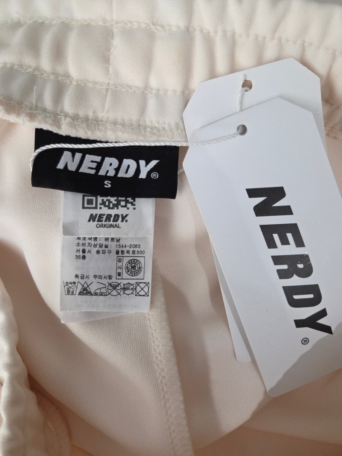 NERDY 널디 심볼 패턴 블록 트랙 팬츠 상품이미지7