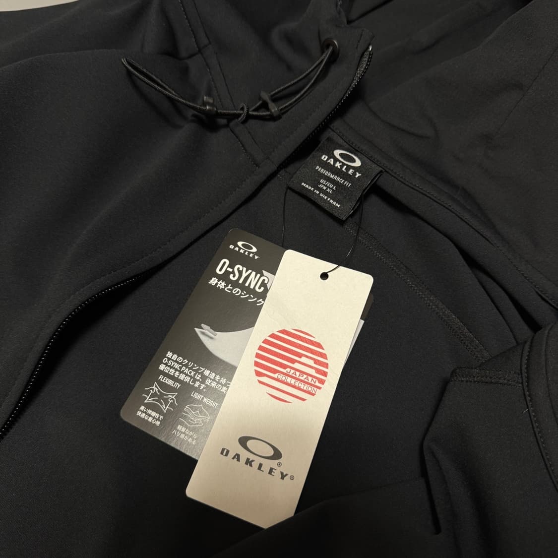 오클리(OAKLEY) 블랙컬러 인핸스 그리드 폴리에스터 후드 윈드브레이커 상품이미지3