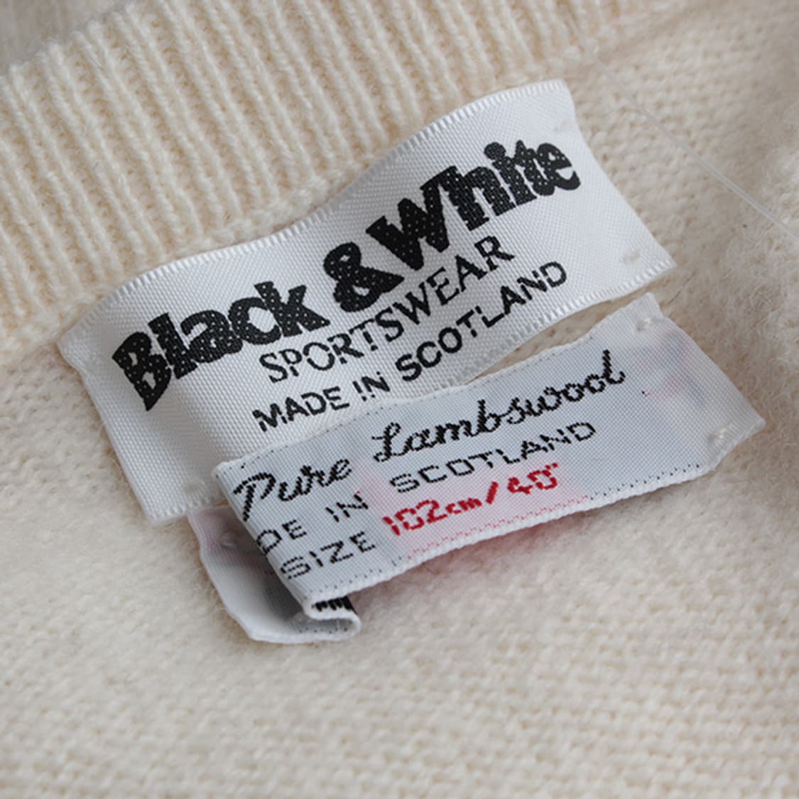 블랙앤화이트 스포츠웨어 아이보리 순모 니트 상의 66 상품이미지4