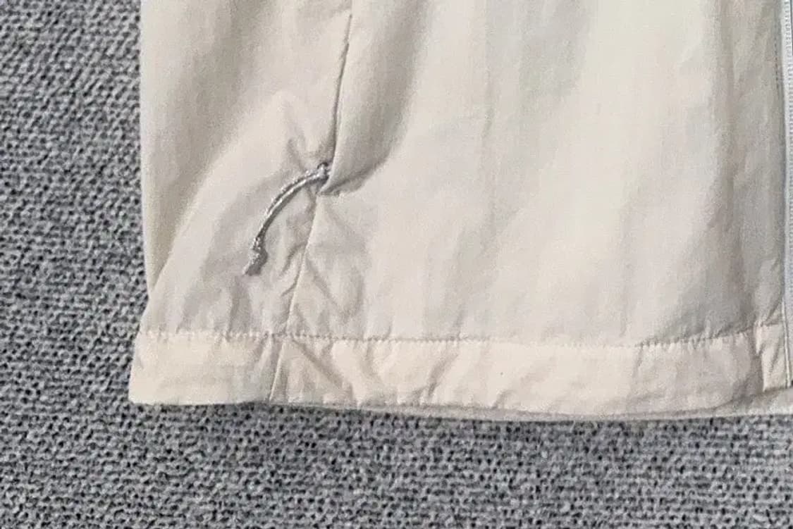 네파 크림 화이트 바람막이 조끼 105 상품이미지6