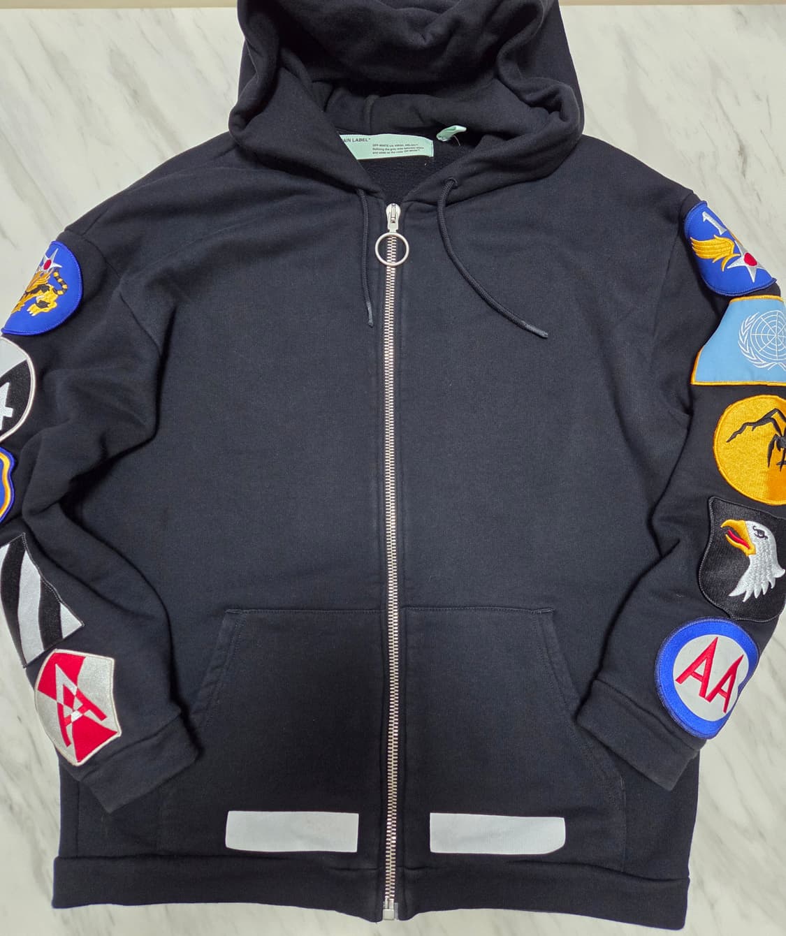 오프화이트 멀티 패치 오버핏 후드집업 상품이미지1