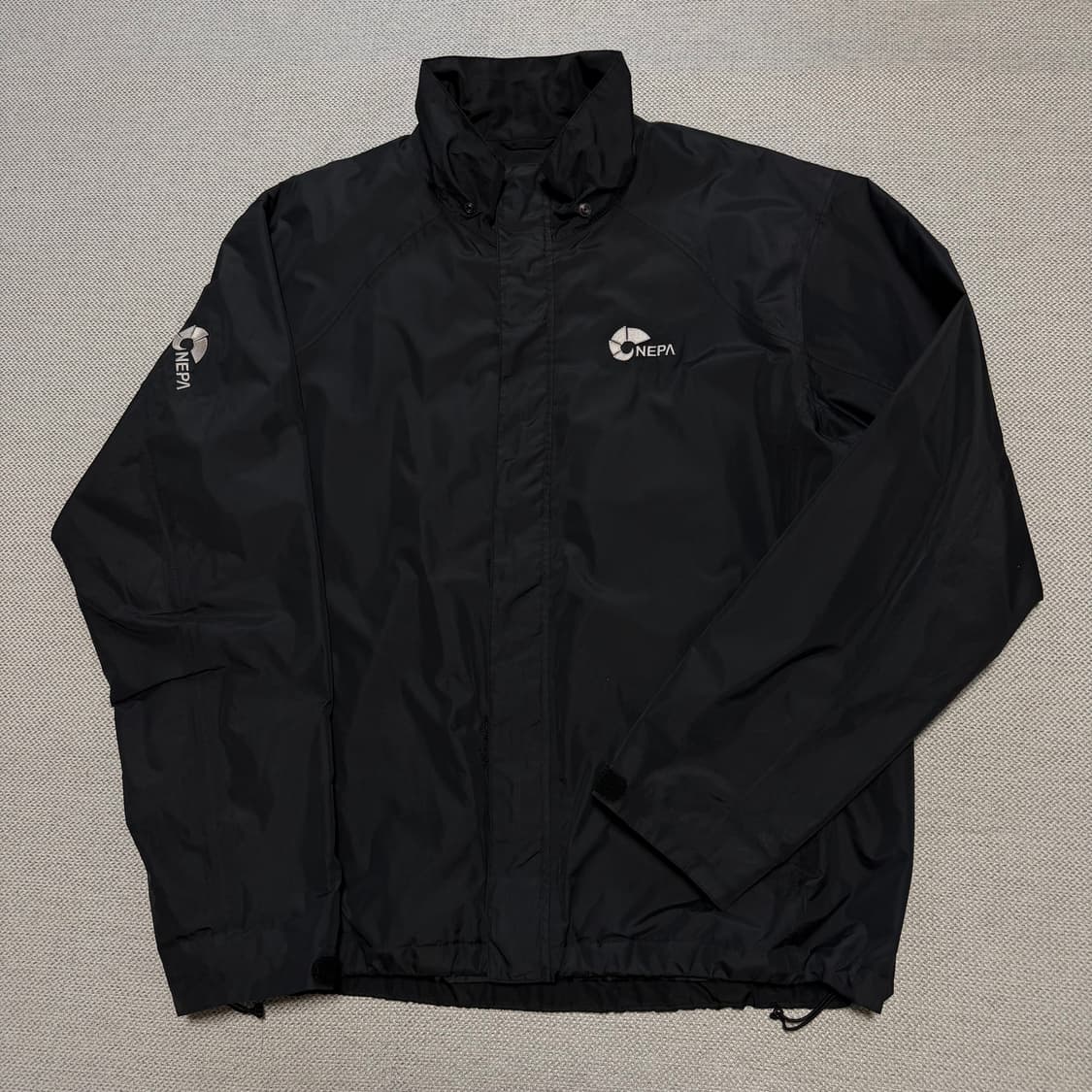 네파 사이드로고 노리밋 바람막이 자켓 상품이미지1