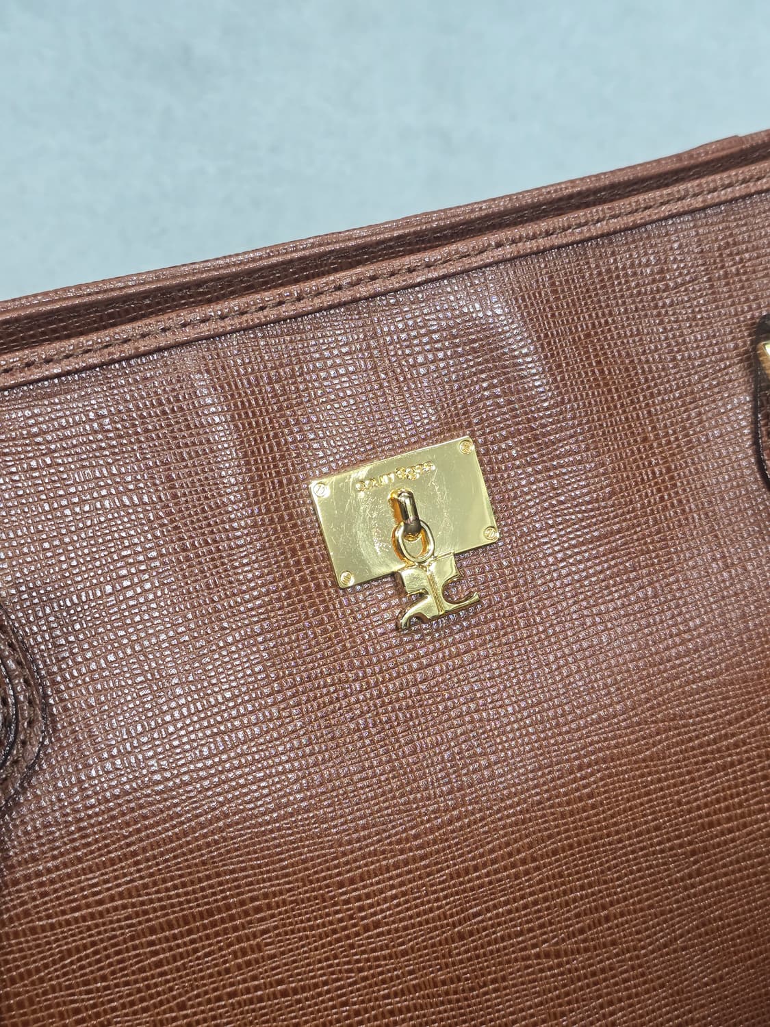 꾸레쥬 금속장식 브라운 레더 숄더백 상품이미지1