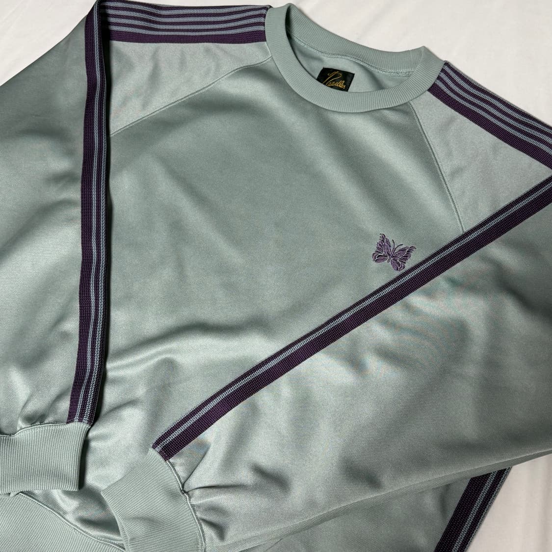 니들스25ss 트랙 크루넥 삭스블루 M 상품이미지1