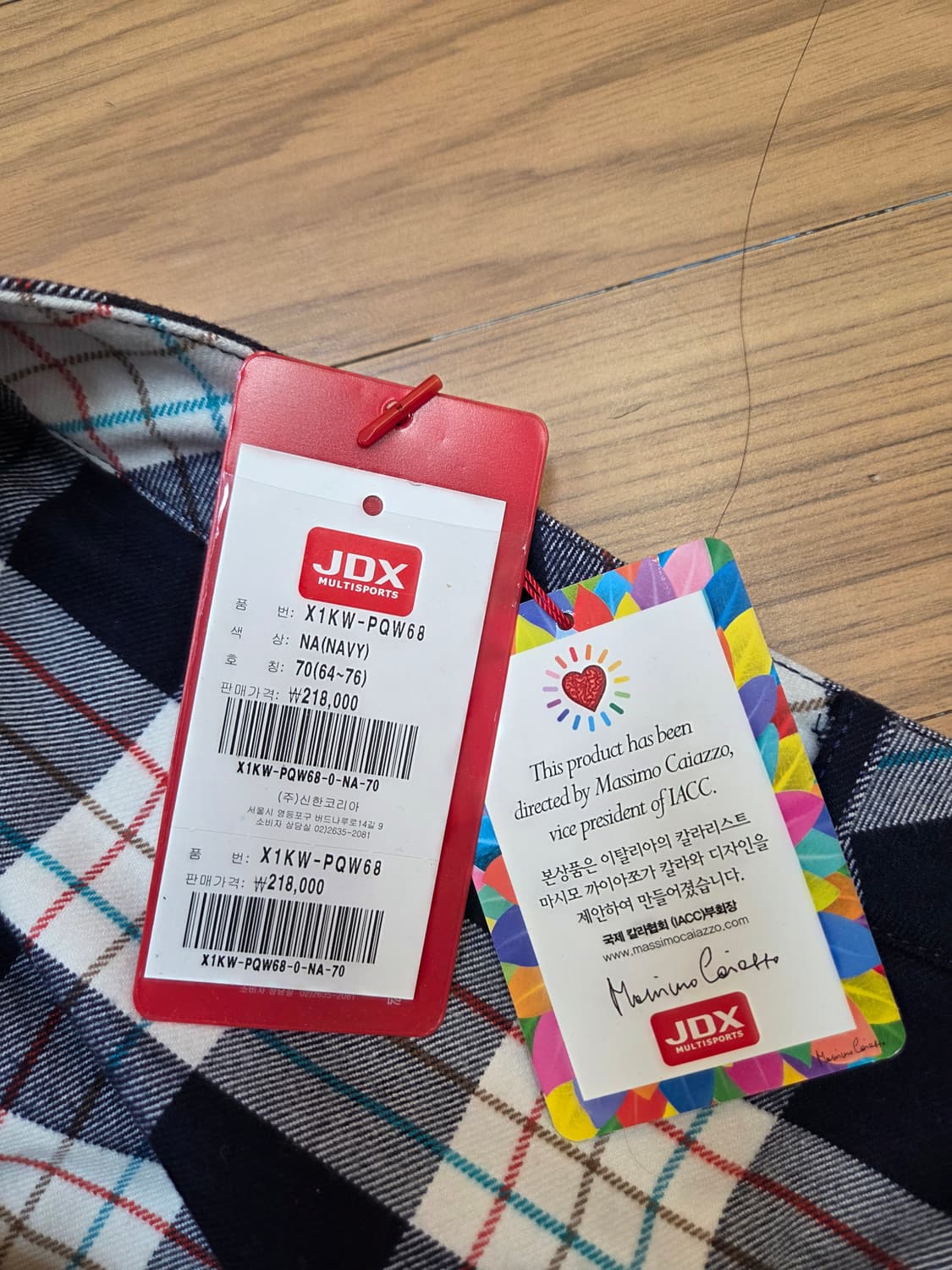 JDX 멀티스포츠 여성 골프 스커트입니다. 네이비 바탕에 흰색, 빨간색, 상품이미지5