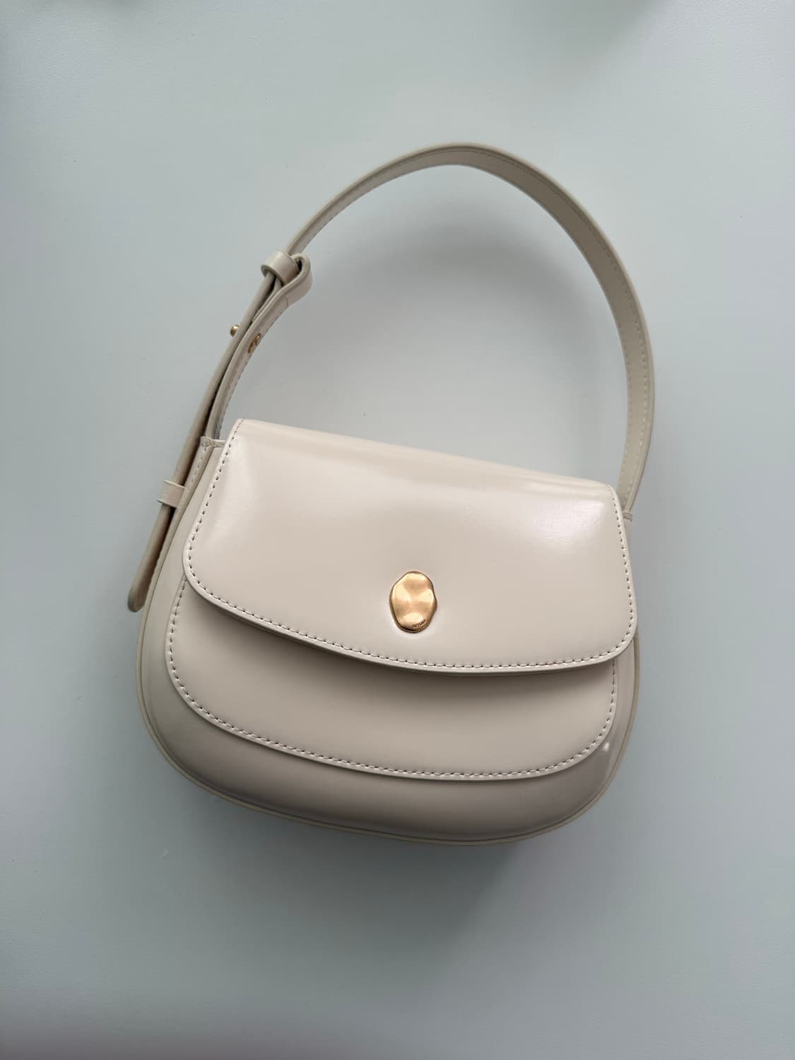 오스트카카 미니새들 아이보리 컬러 미착용 제품 상품이미지1