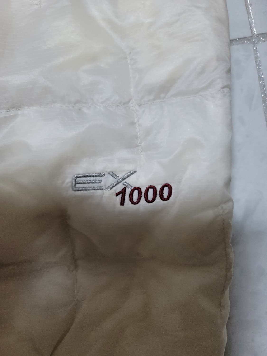 플라즈마 1000 경량패딩 아이보리 105사이즈 상태극상
 상품이미지4