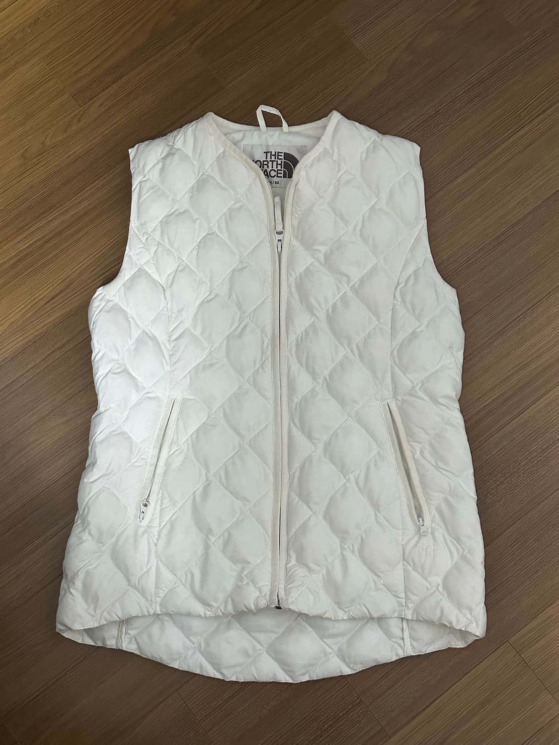 노스페이스 여성 패딩 조끼 아이보리 상품이미지1