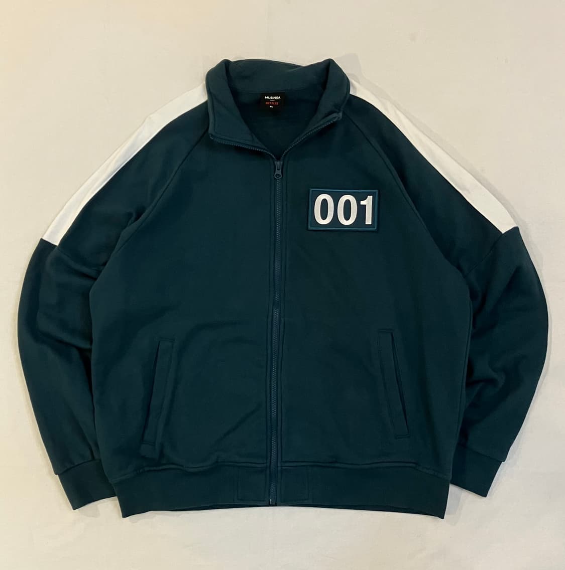 무신사 X 넷플릭스 오징어게임 오일남 001 져지 상품이미지1