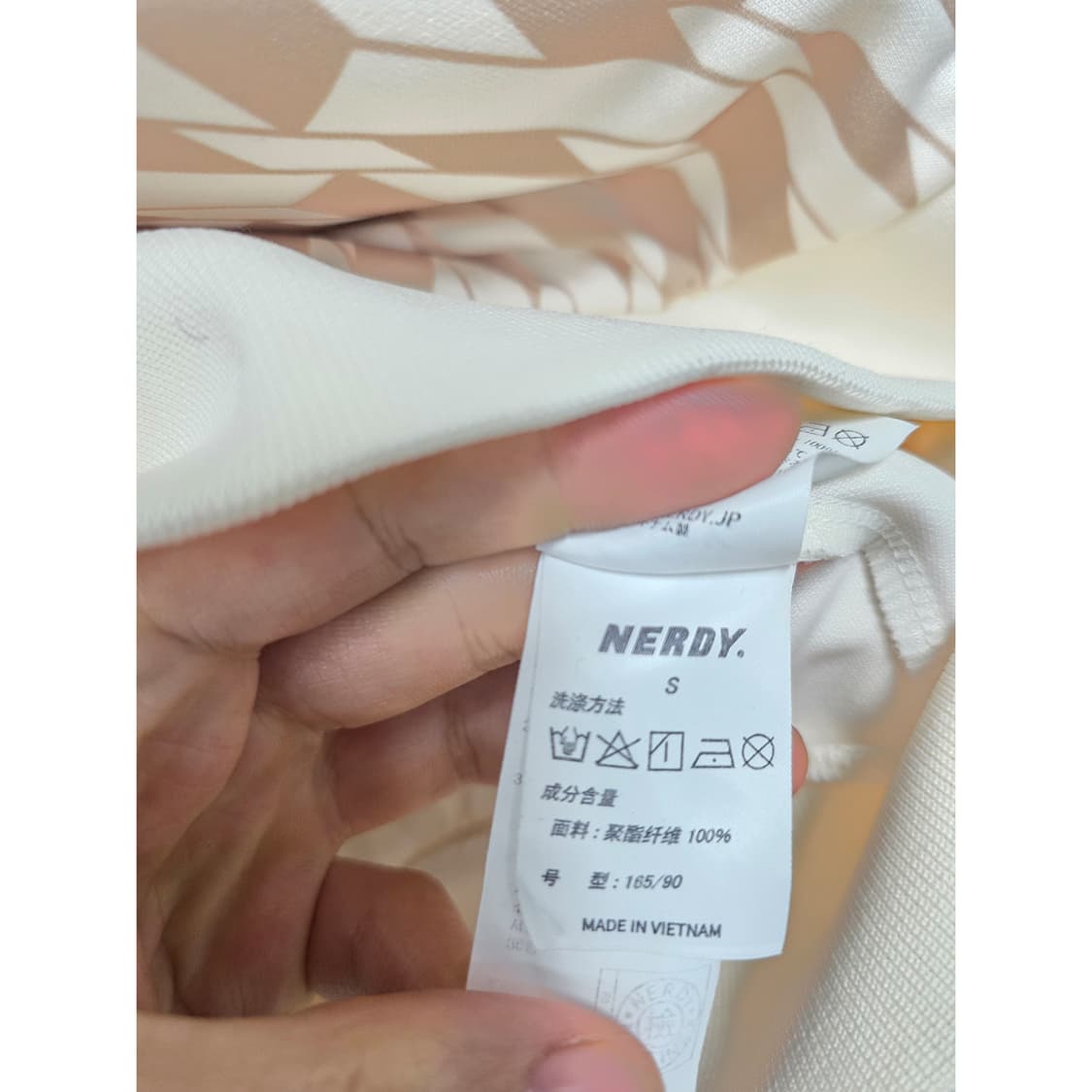 택포// 널디 심볼 패턴 트랙탑 L 크림 상품이미지3