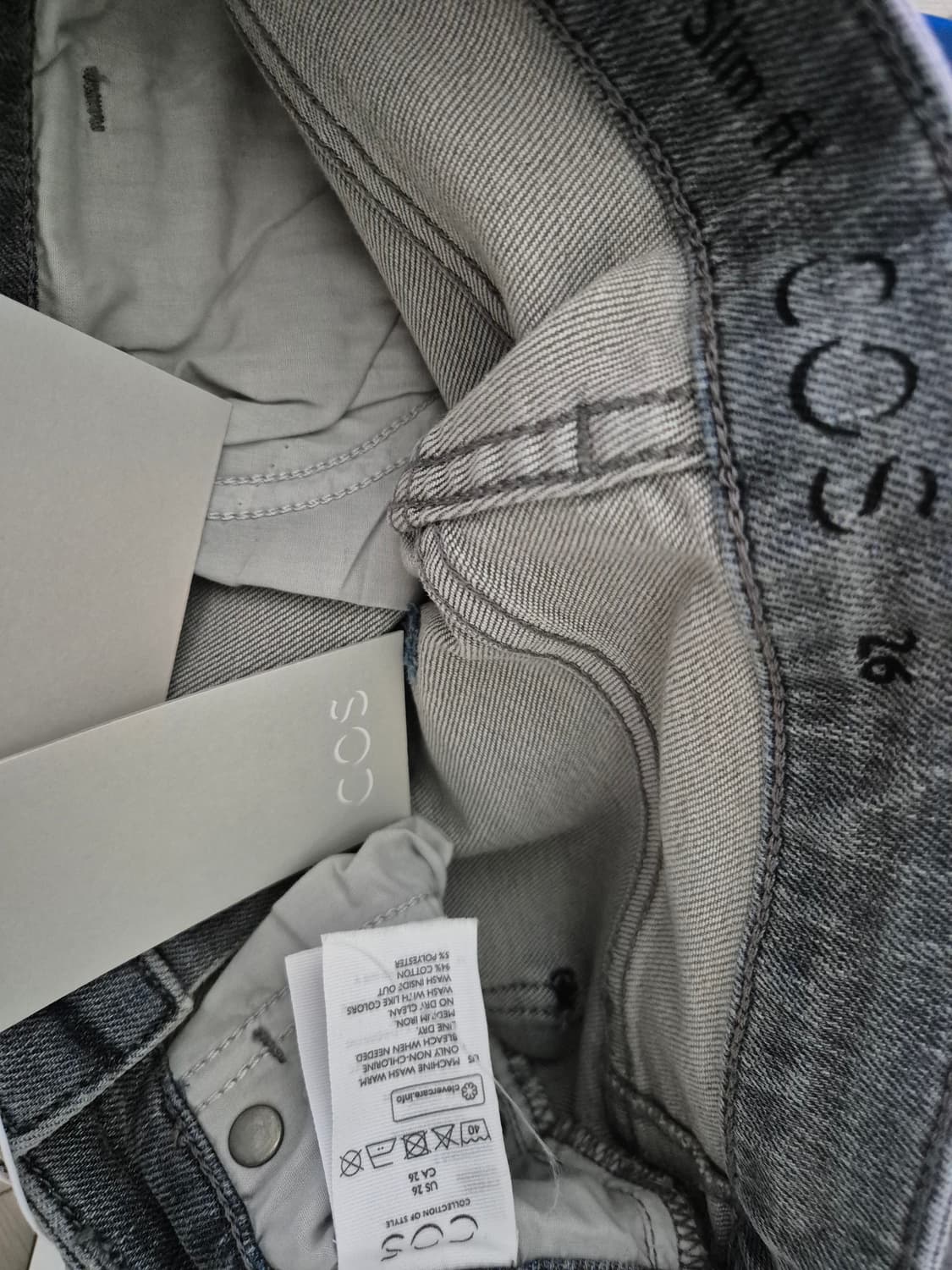 COS (택달린 새 옷) 상품이미지3