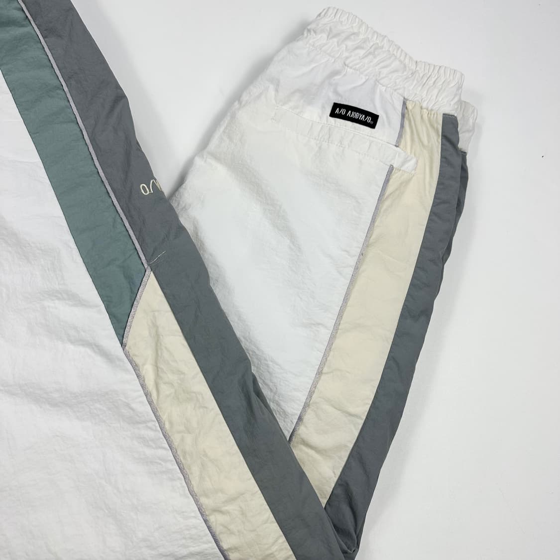 아조바이아조 화이트 배색 우븐 조거팬츠 (M) 상품이미지1
