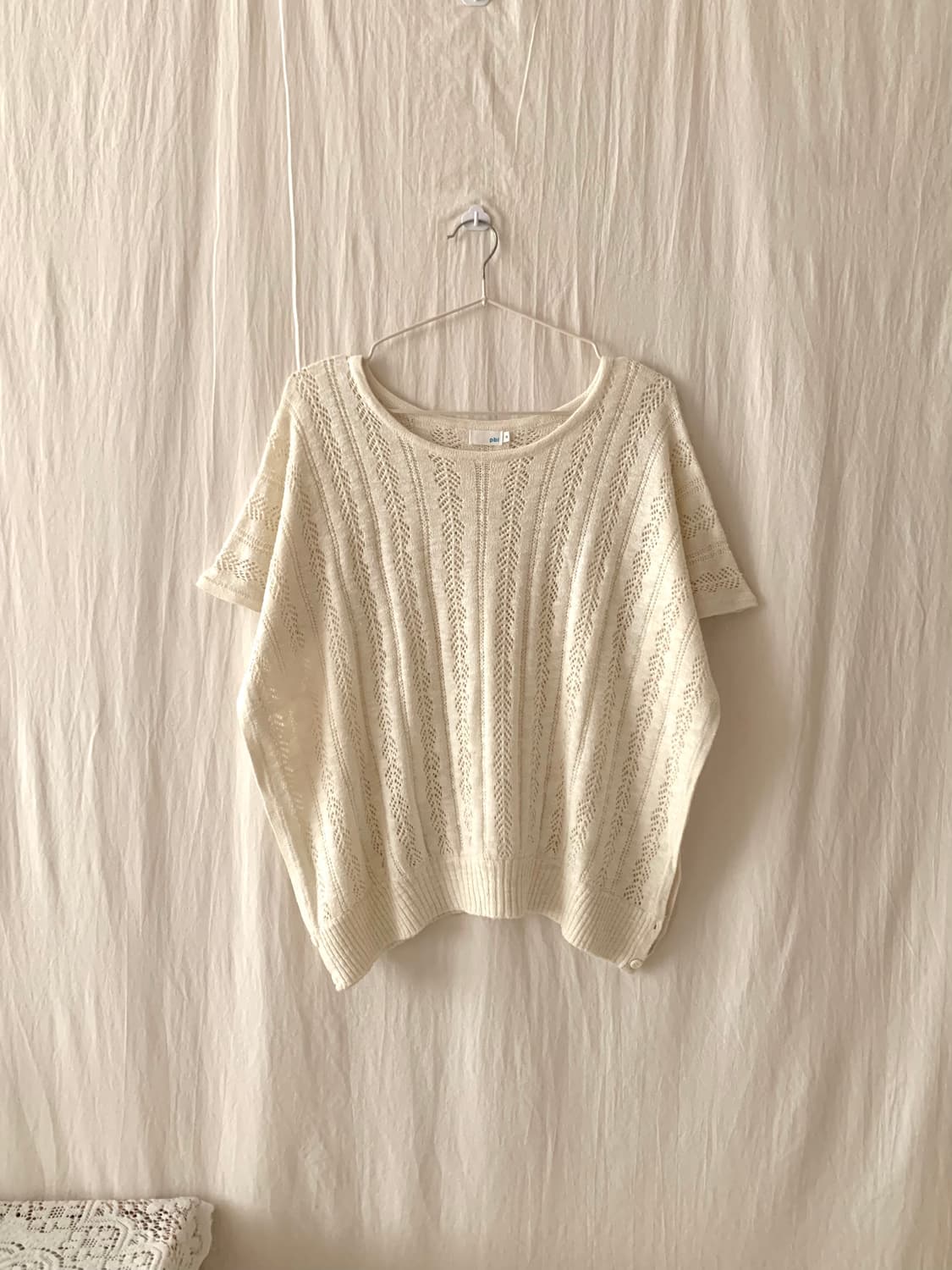 아이보리 펀칭 레이어드 니트 상품이미지1