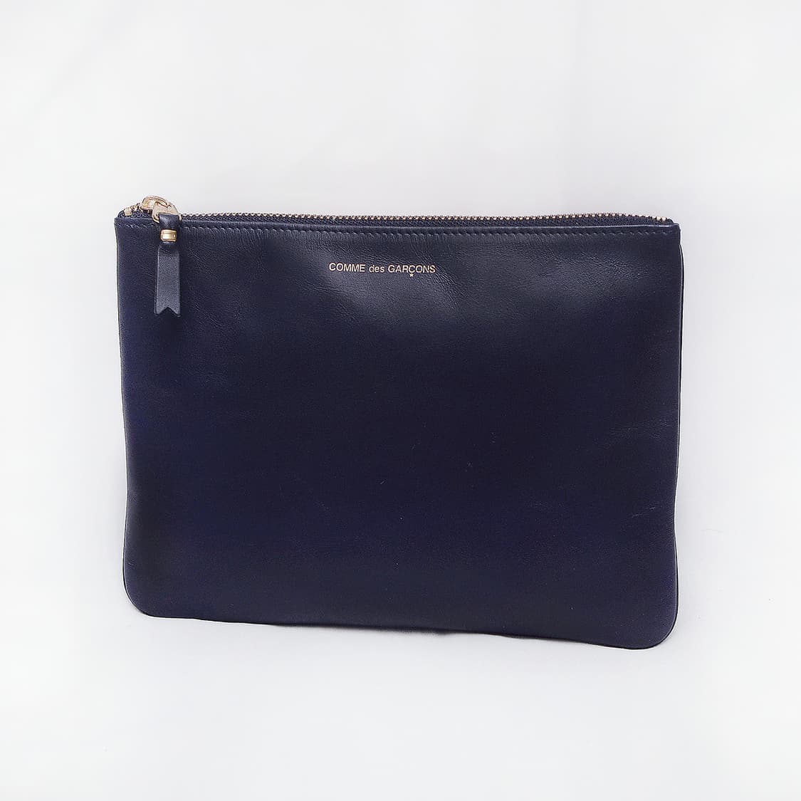 꼼데가르송 금장 로고 카프스킨 레더 클러치백 상품이미지1