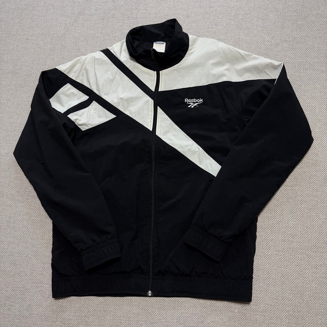 리복 빅로고 패턴 바람막이 자켓 상품이미지1