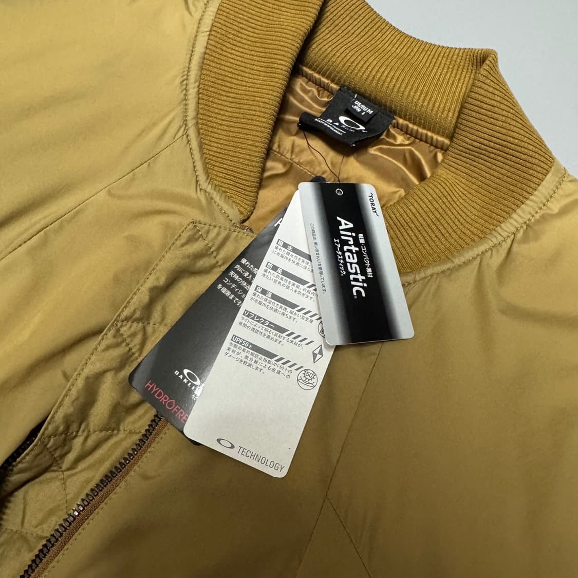 오클리(OAKLEY) 베이지컬러 서클로고 나일론 인슐레이션 블루종 자켓 상품이미지4