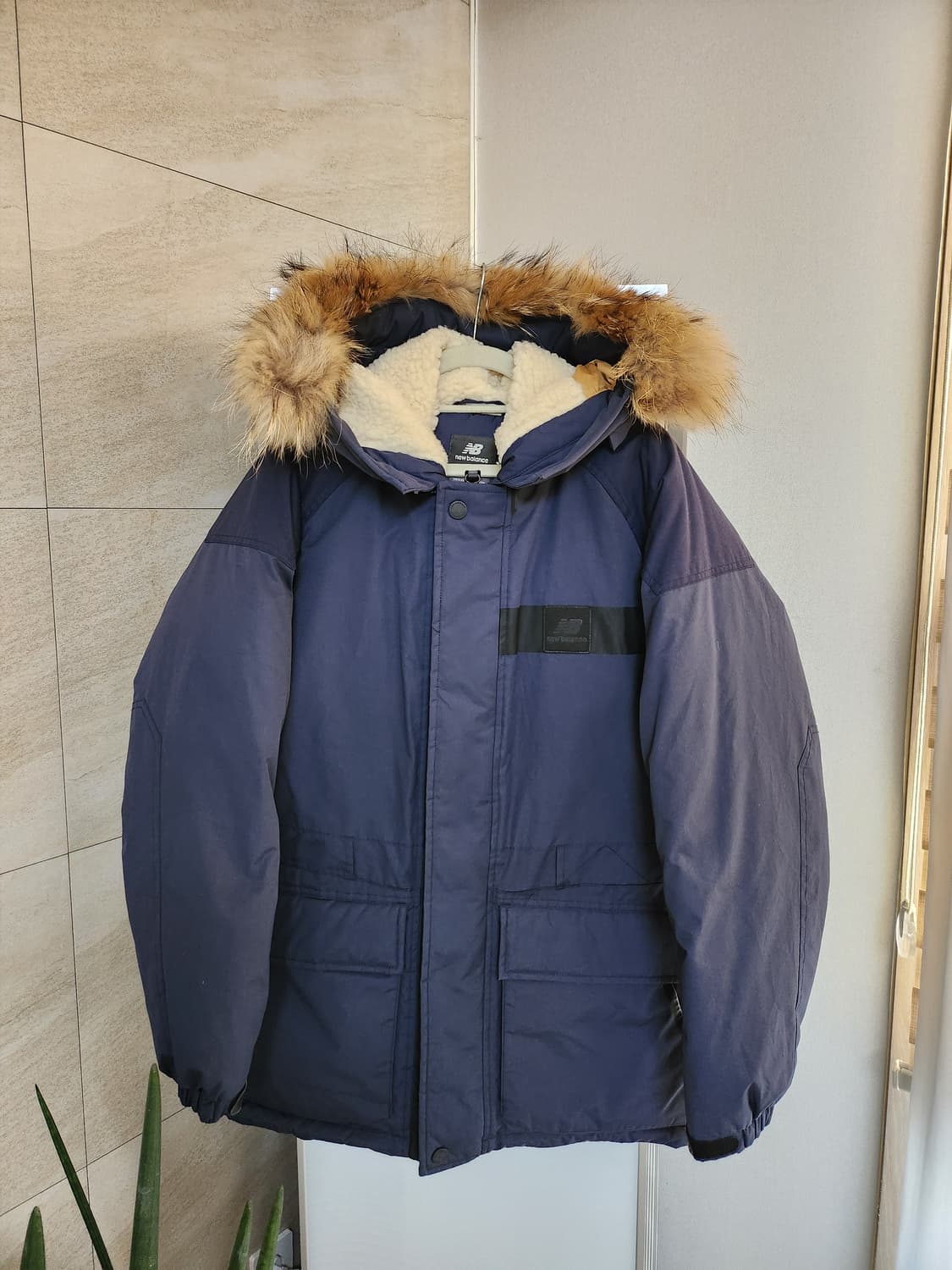 뉴발란스 카메라맨 덕다운 패딩 상품이미지1