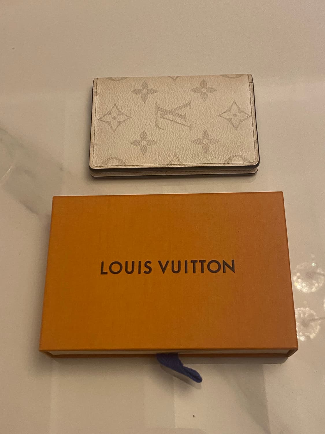 [정품] 루이비통의 옵틱 화이트 컬러 오거나이저 지갑 상품이미지1
