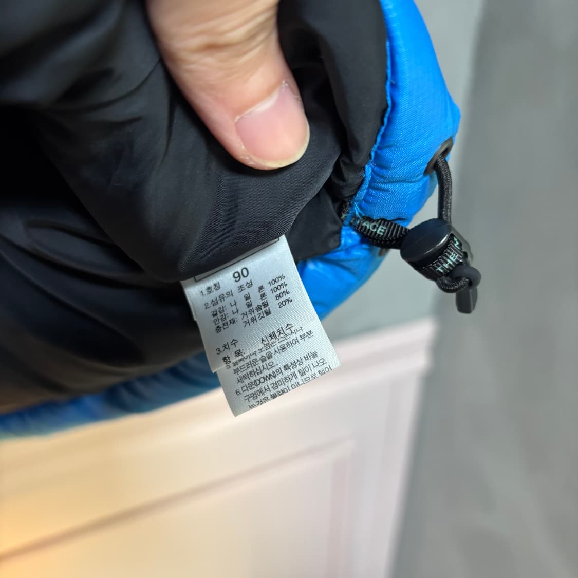 노스페이스 700 눕시 구스다운 패딩조끼 스카이블루 상품이미지4