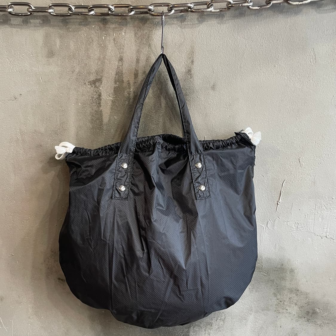 꼼데가르송 나일론 드로스트링 백 상품이미지1