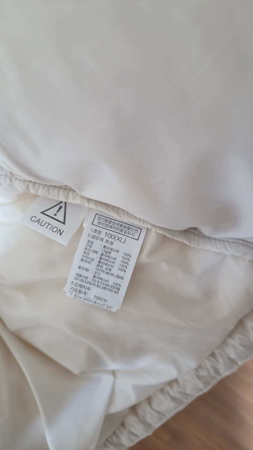 노스페이스 화이트 라벨 노벨티 눕시 다운 자켓 크림 상품이미지5