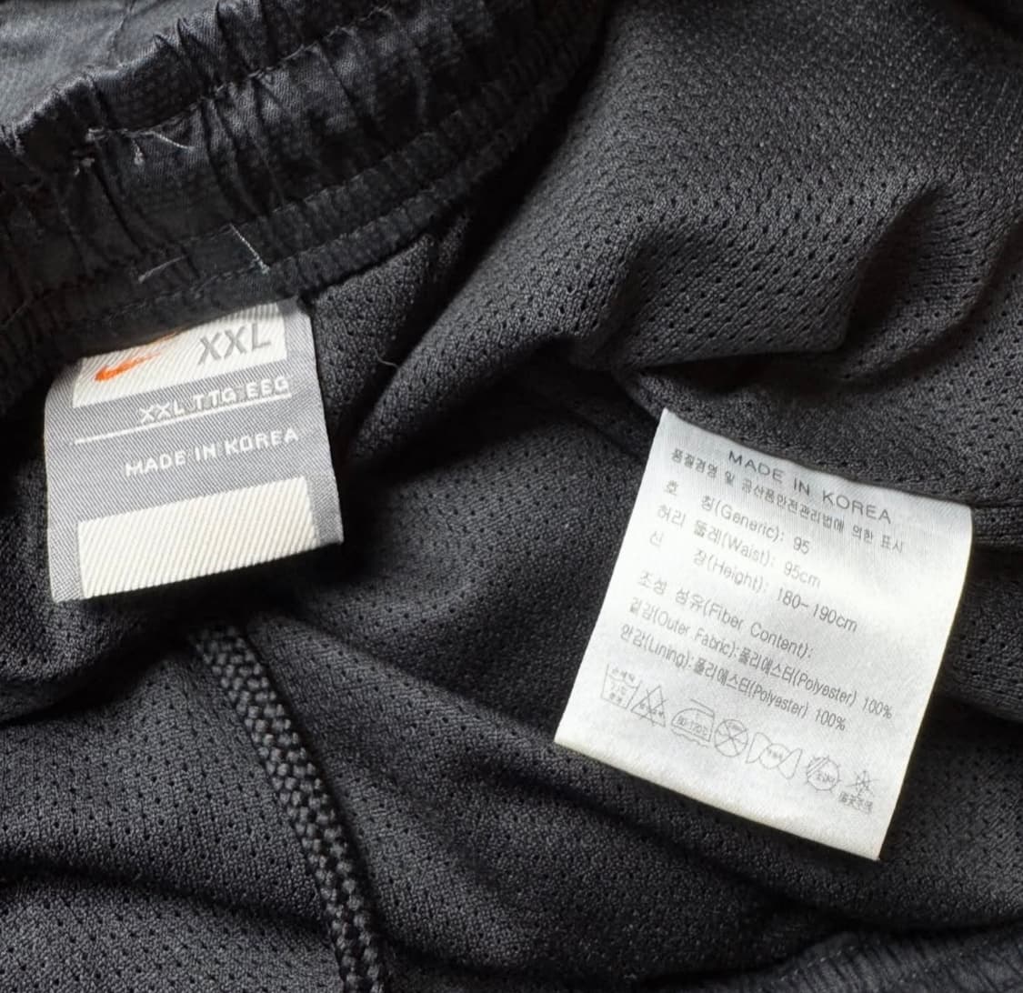 나이키 블랙스우시 지퍼 절개 트랙팬츠. 상품이미지5