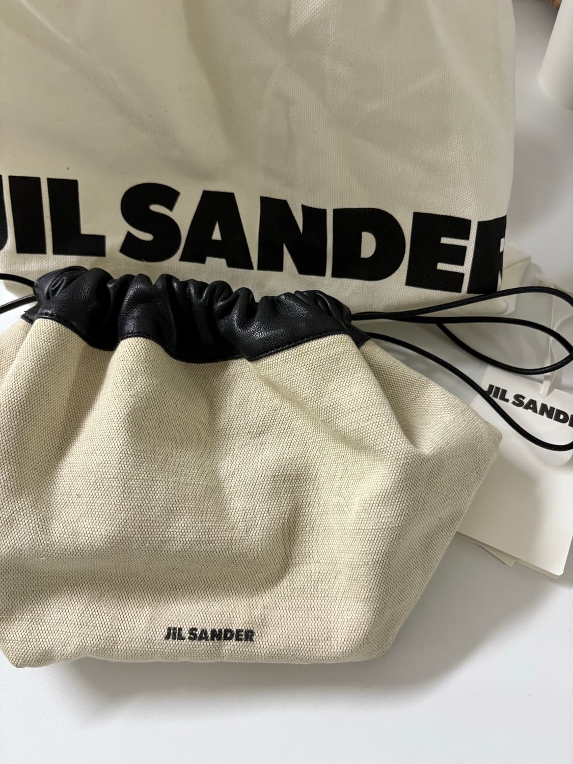 질샌더 드로우 스트링 캔버스 크로스바디 백 상품이미지3