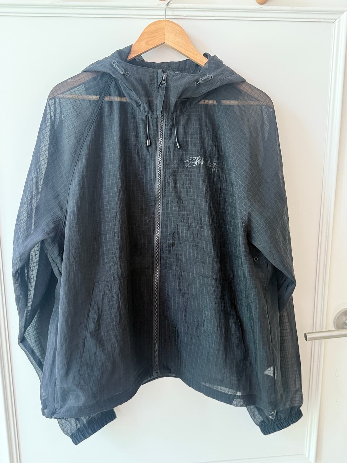 스투시(Stussy) 비치 쉘 트랜스패런트 립스탑 블랙 재킷 상품이미지1