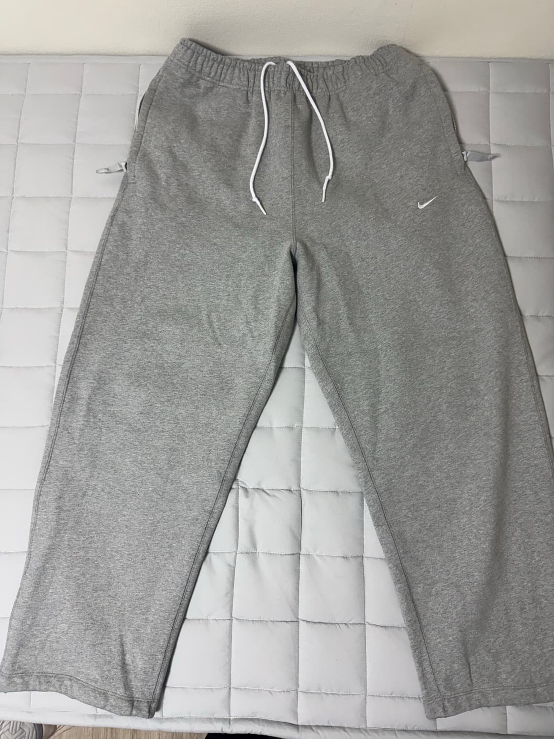 스포츠웨어 스우시 오픈 헴 플리스 팬츠 상품이미지1