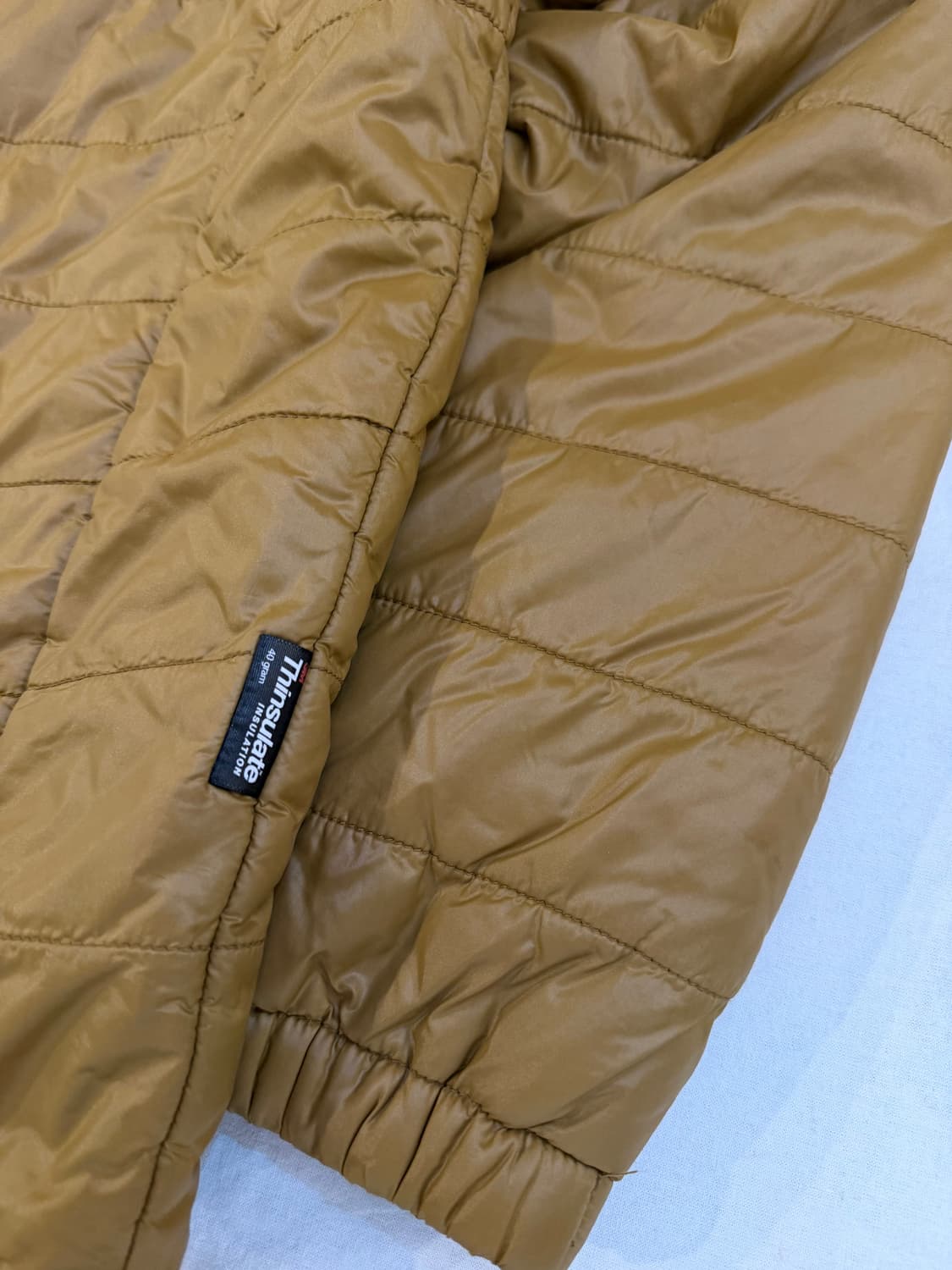 마모트 시그니쳐 로고 씬슐레이트 경량패딩 머스타드 상품이미지3