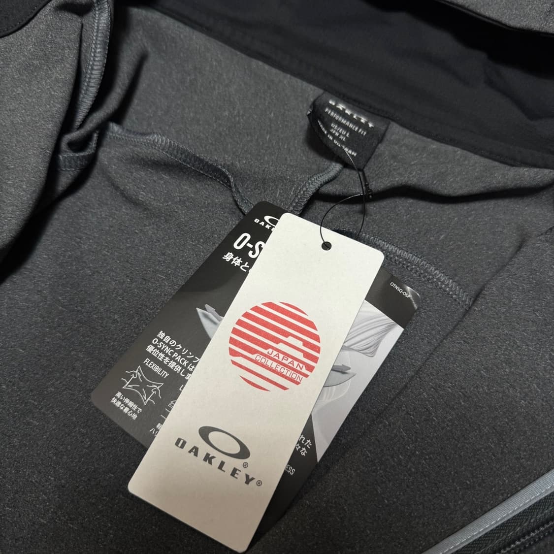 오클리(OAKLEY) 차콜컬러 인핸스 그리드 폴리에스터 후드 윈드브레이커 상품이미지3
