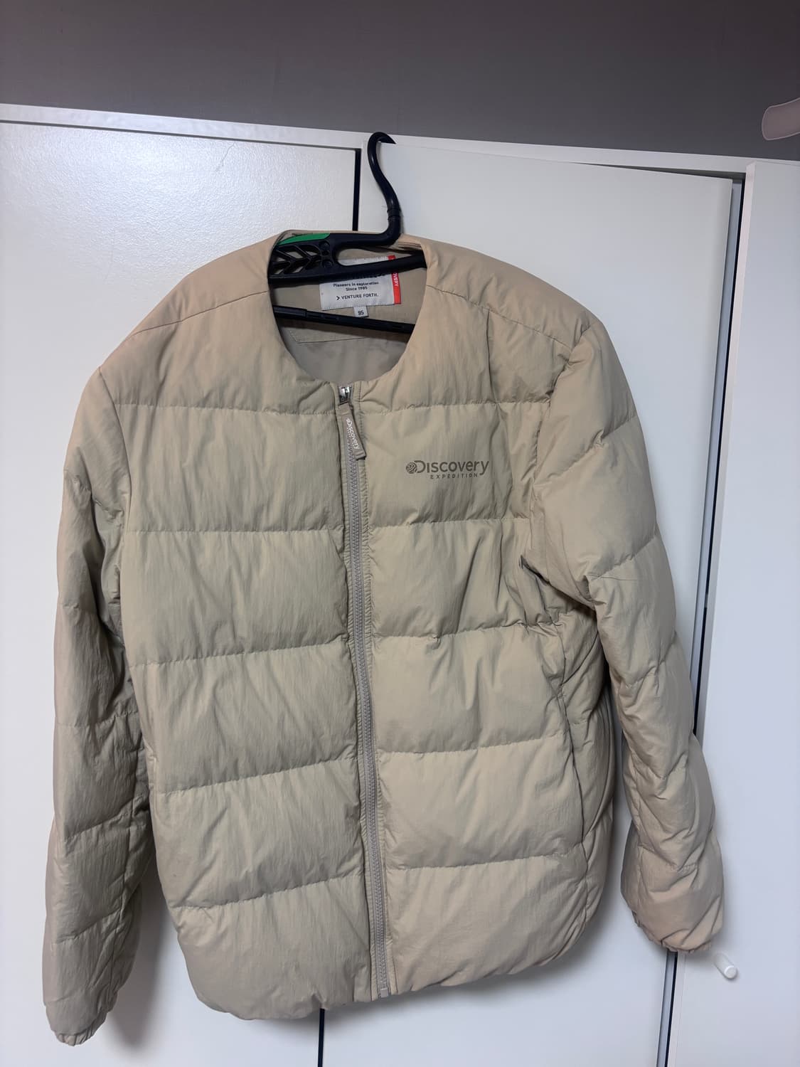 디스커버리 베이지 경량패딩 95 상품이미지1