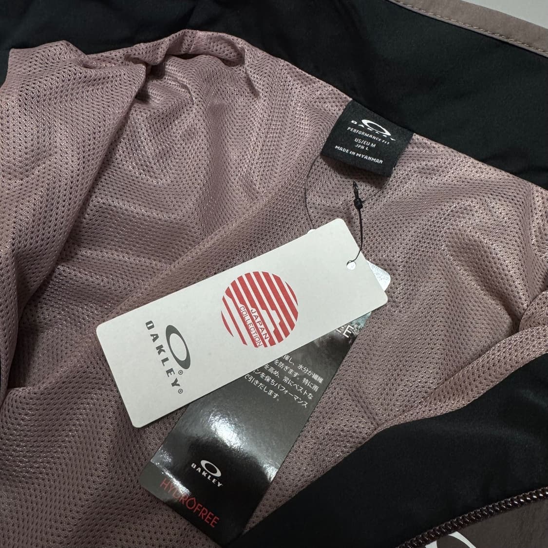 오클리(OAKLEY) 브라운 인디핑크 컬러블록 테크 하이넥 윈드브레이커 상품이미지3