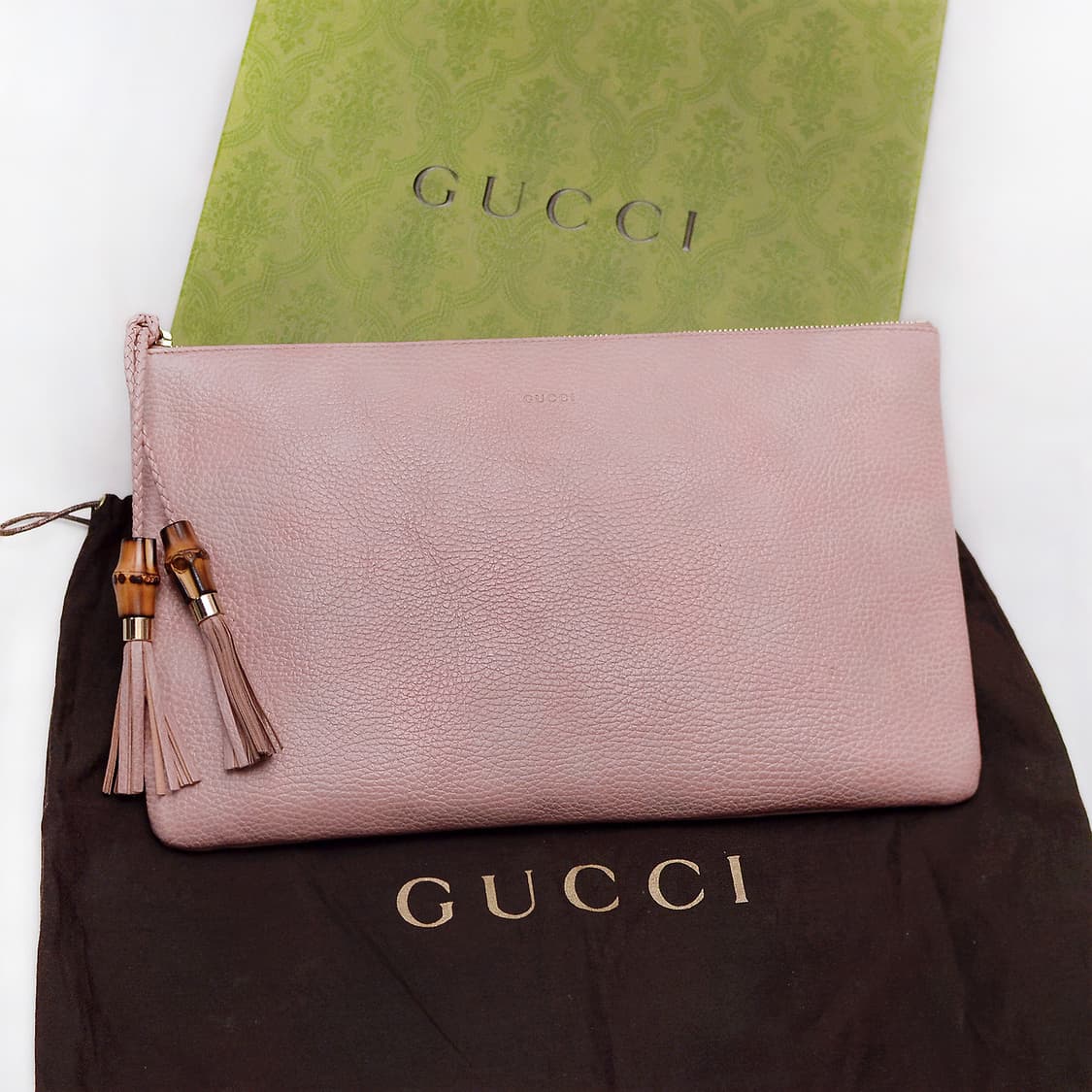 구찌 (GUCCI) 뱀부 테슬 페일핑크 토고가죽 클러치백 상품이미지1
