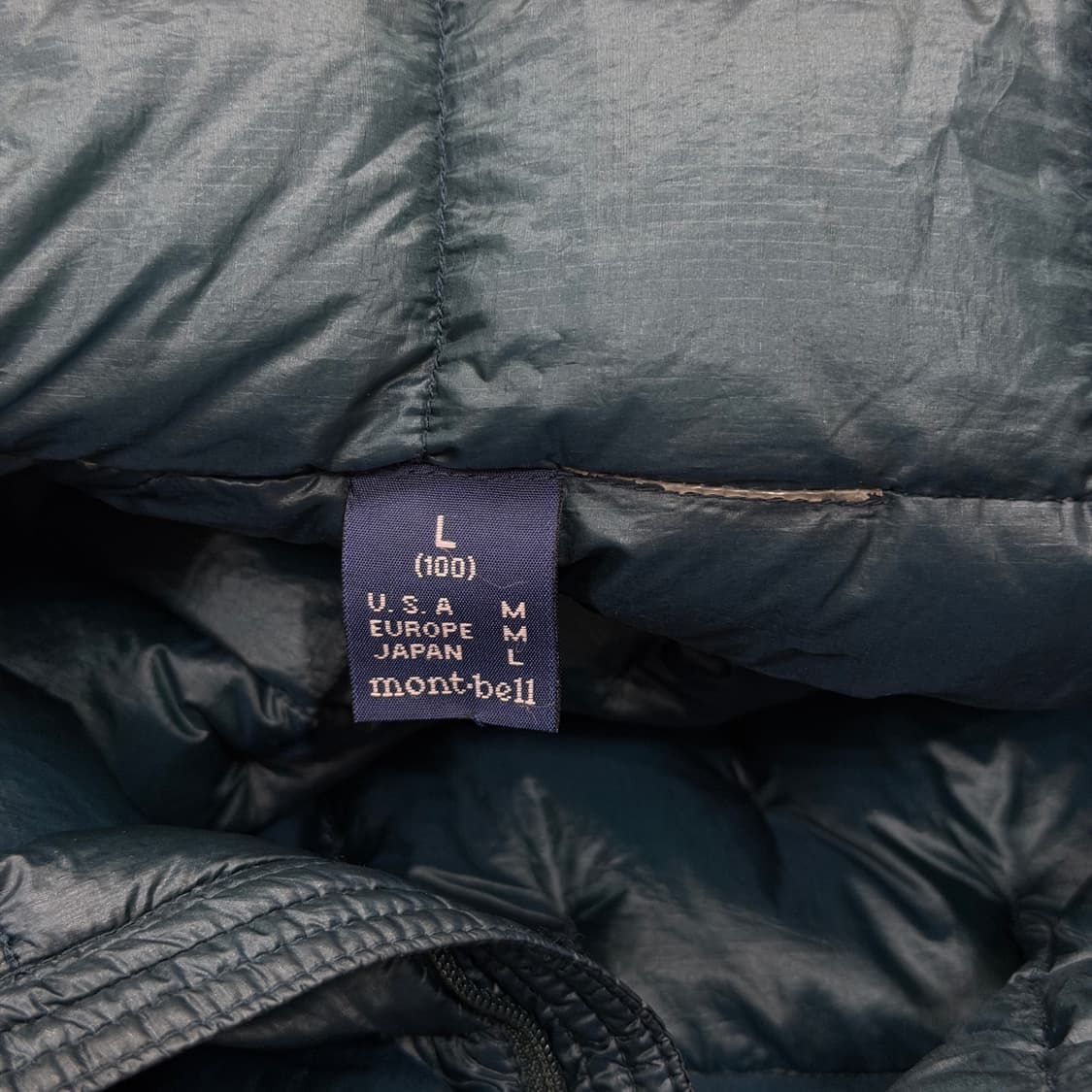 몽벨 플리즈마 1000 필파워 초경량 나일론 패딩 토바코블루 L 상품이미지7