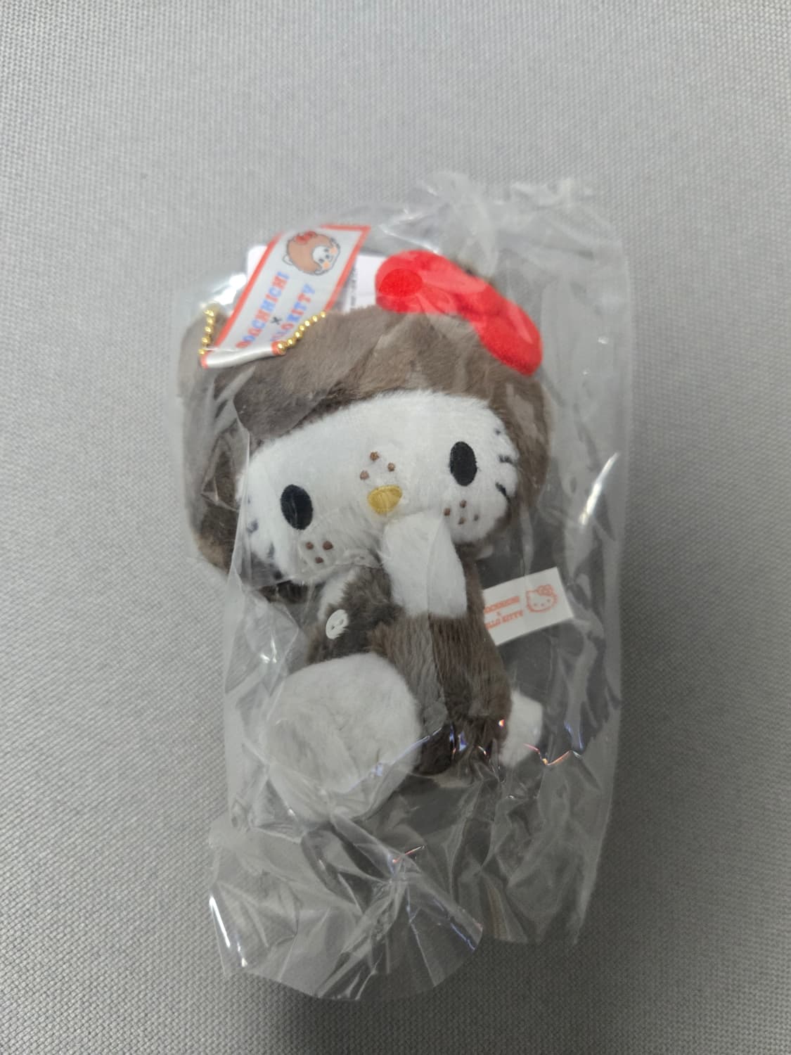 산리오 헬로 키티 x 몬치치 50주년 기념 헬로 키티 홀더 상품이미지1