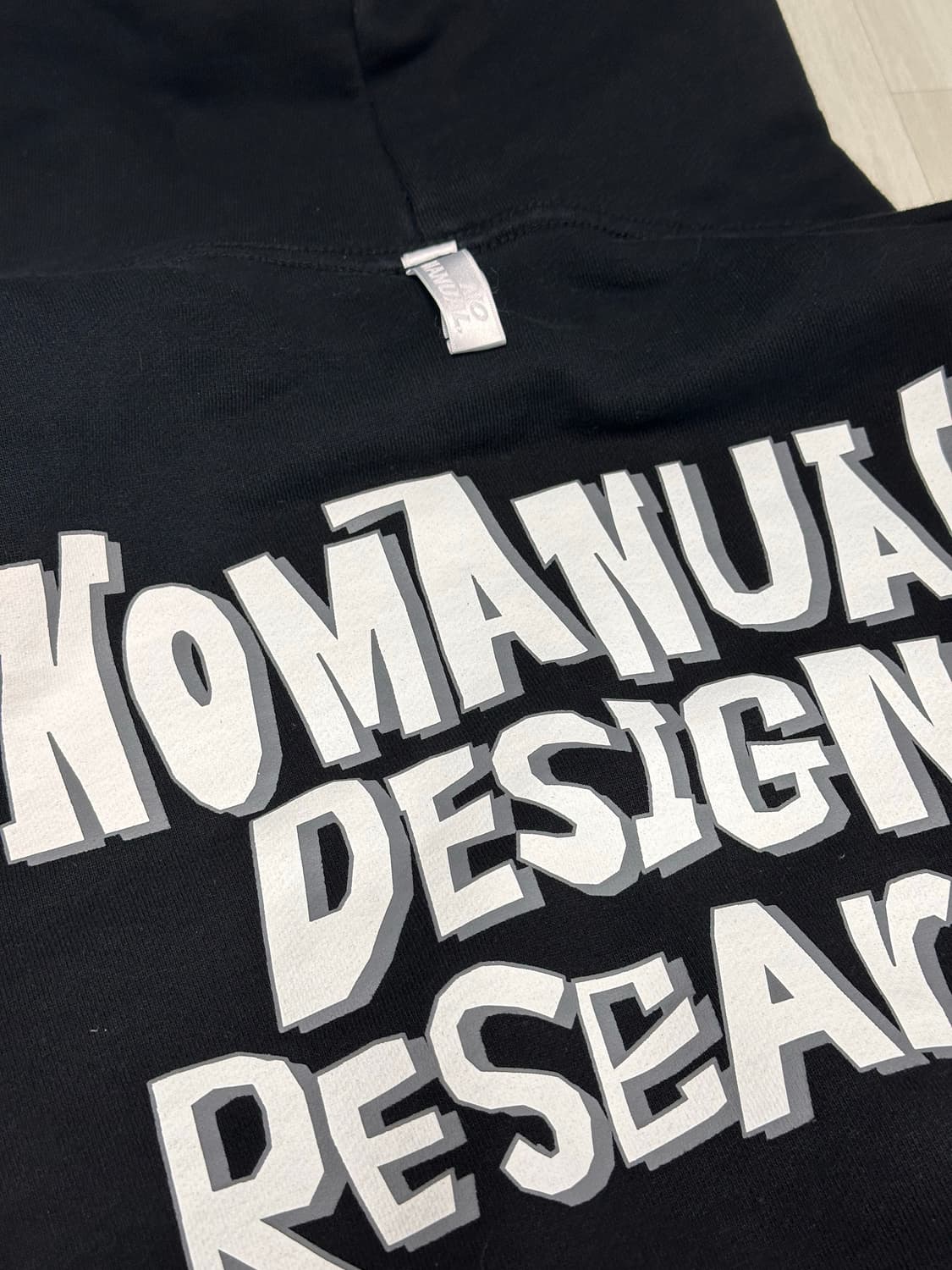 노메뉴얼 DOODLE LOGO HOODIE - BLACK 상품이미지1