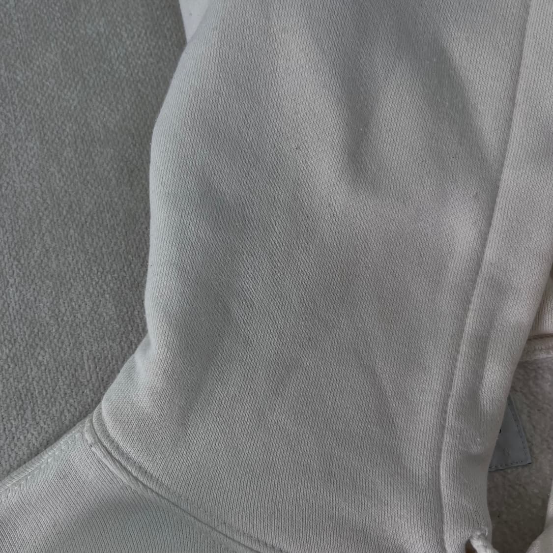 100 디스이즈네버댓 크림 빅로고 후드티 상품이미지4