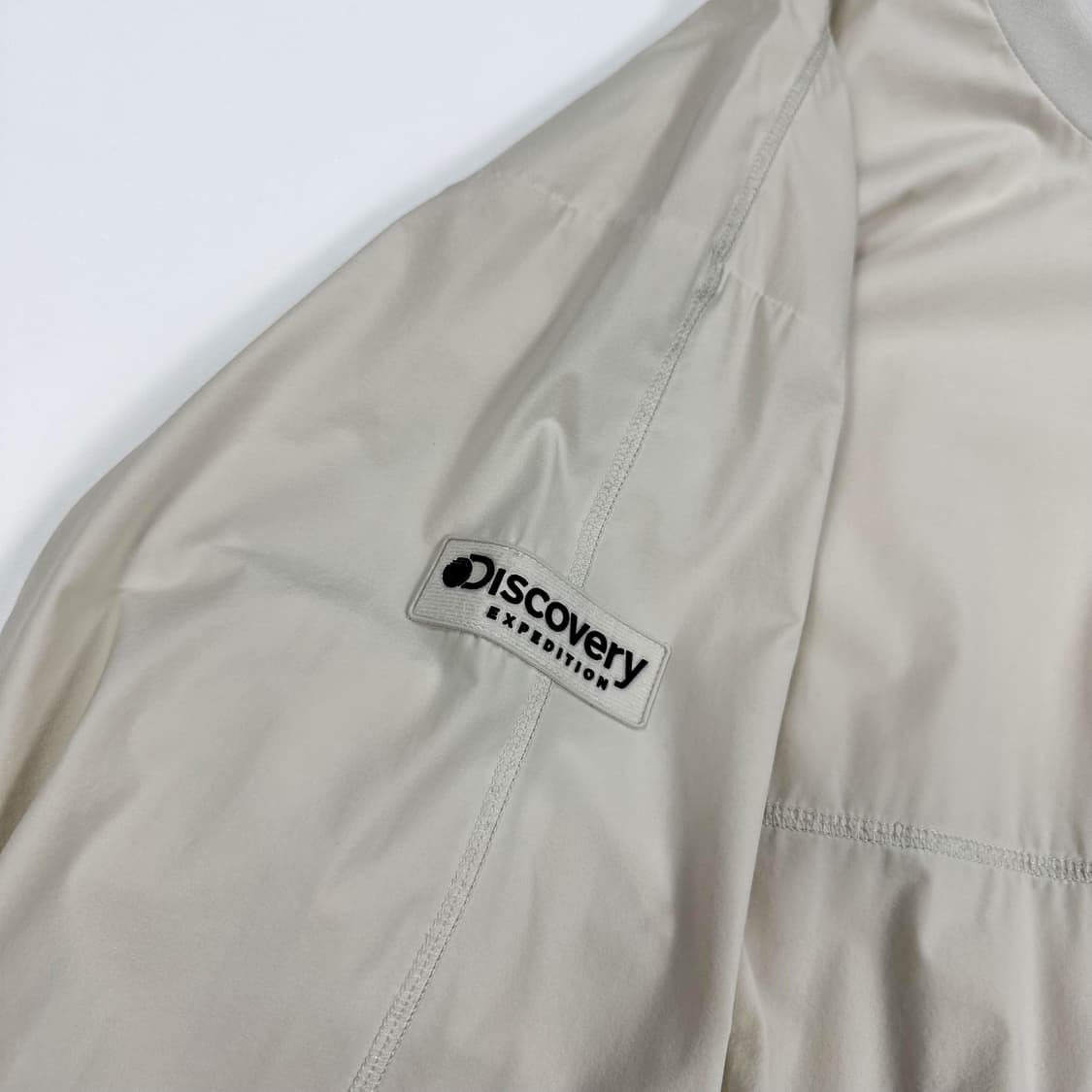 디스커버리 트레이닝 아이보리 바람막이 웜업 (XL) 상품이미지5