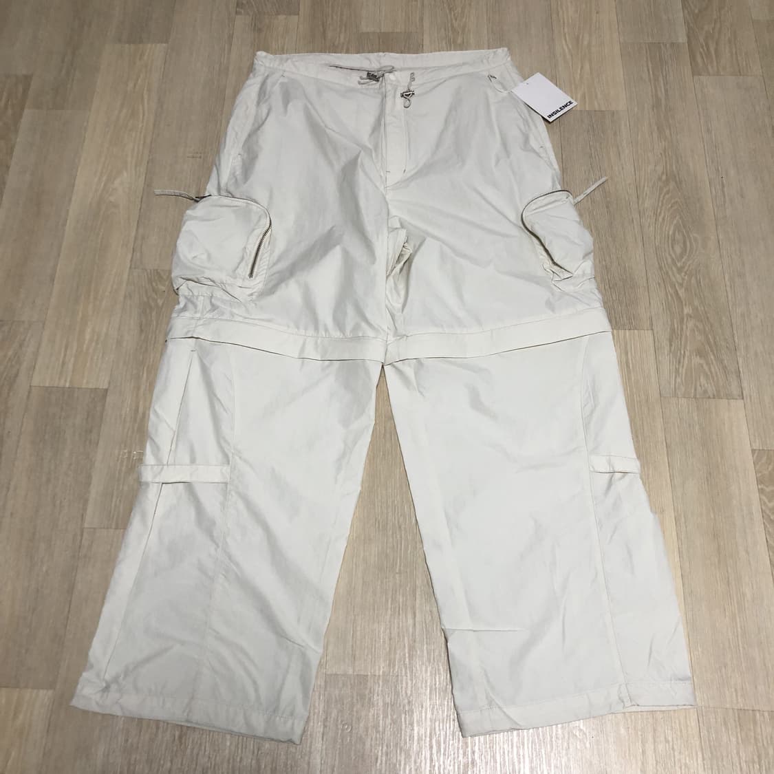 (L) 새상품 인사일런스 INSILENCE 디태처블 트랙 카고 팬츠 크림 상품이미지1