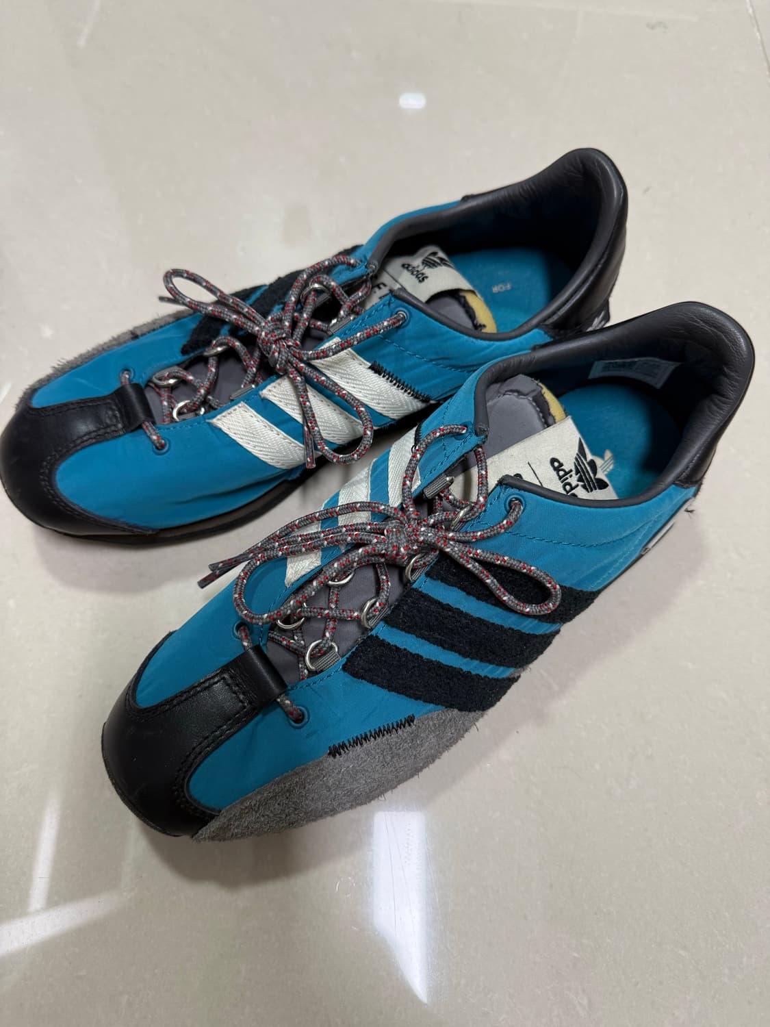 아디다스x송 포 더 뮤트 컨트리  OG 액티브 틸 코어 블랙 운동화 23 상품이미지1