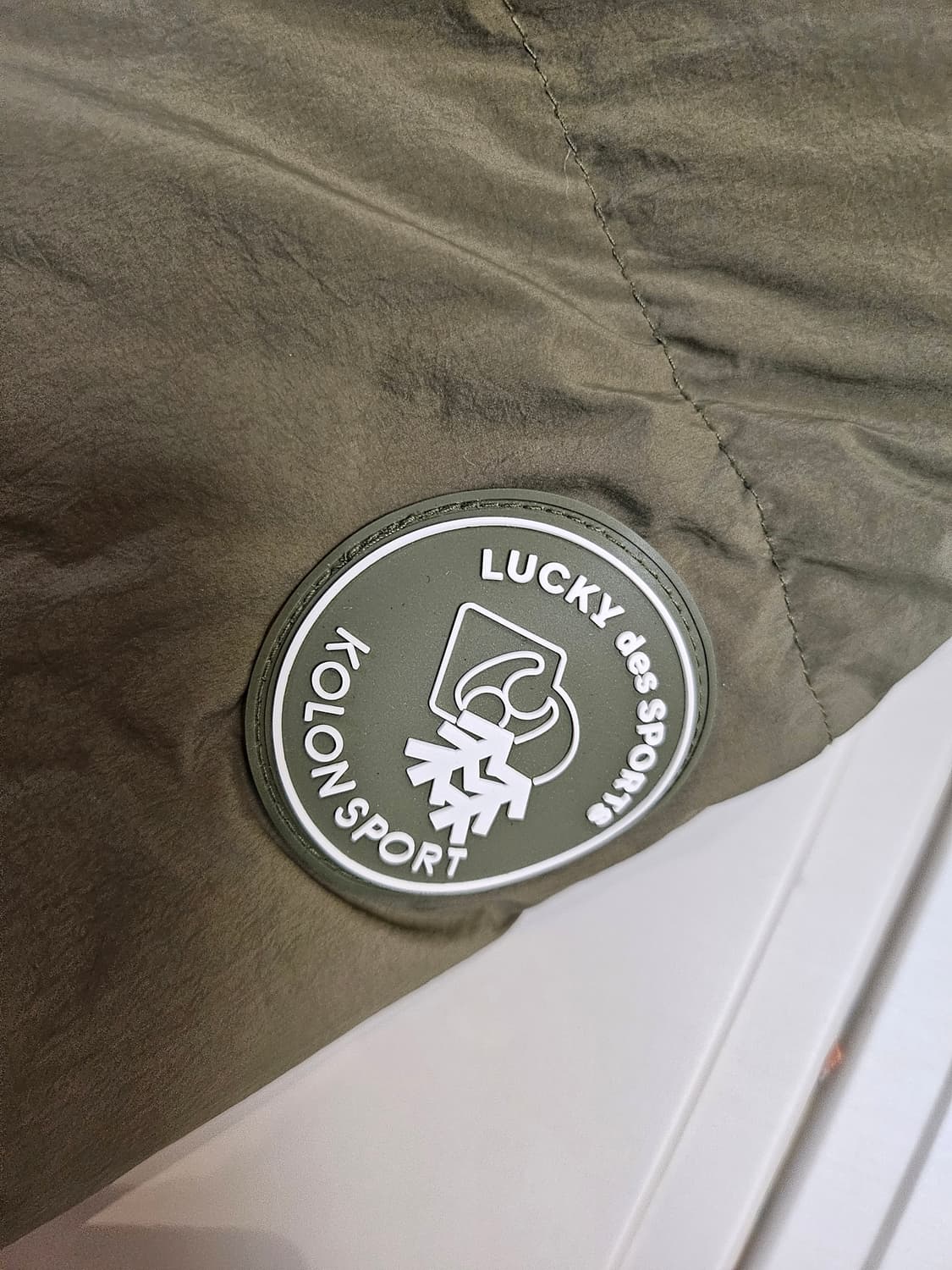 럭키슈에뜨 코오롱 스포츠 콜라보 구스 패딩 상품이미지4