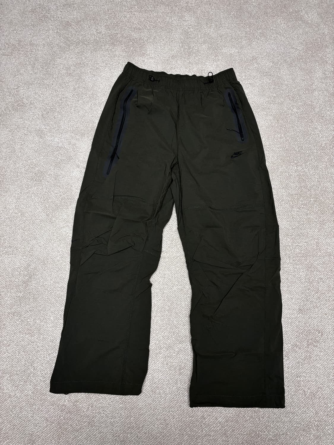 [NIKE] 테크 우븐 오픈 헴 오버사이즈드 팬츠 상품이미지1