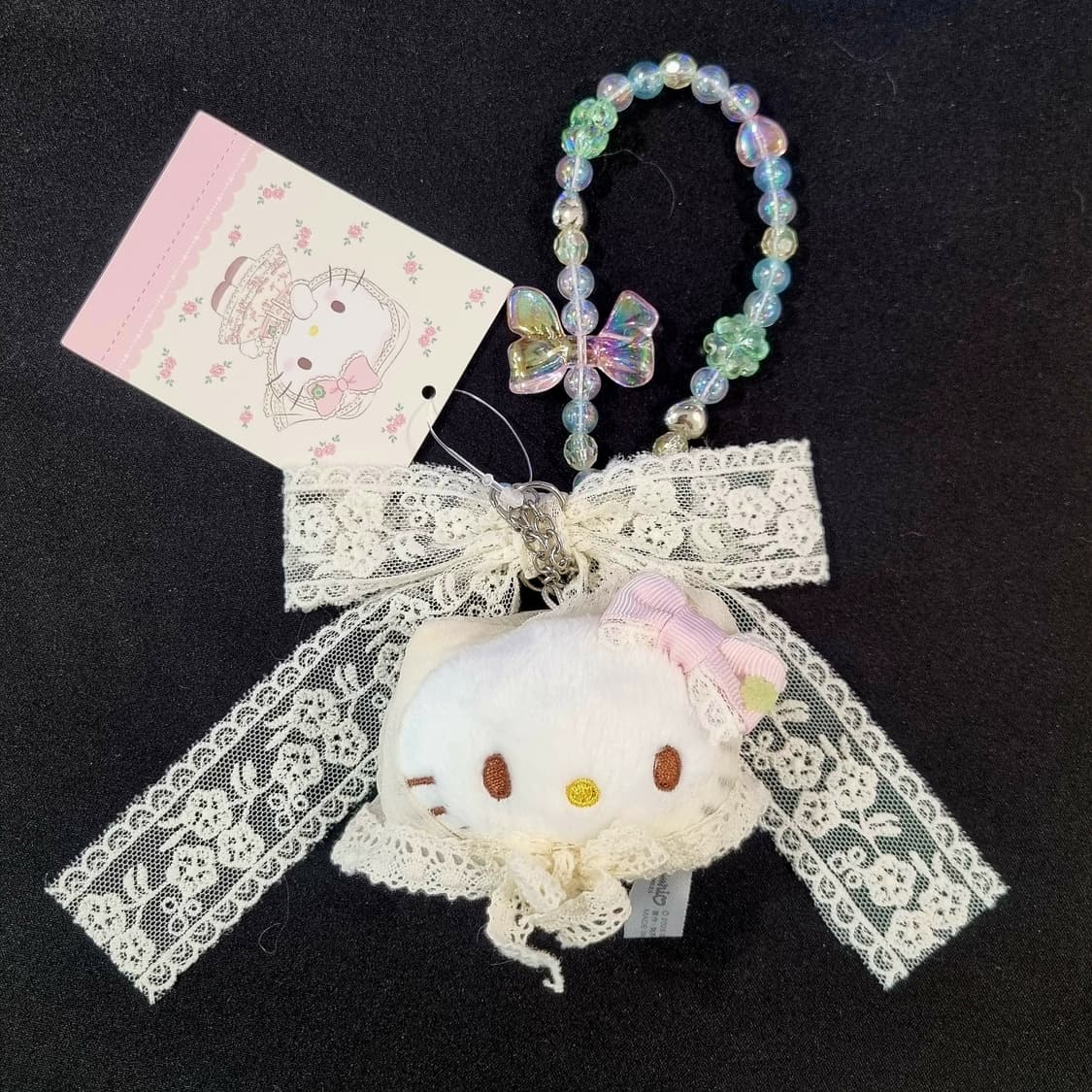 산리오 헬로키티 포레스트 레이스 시리즈 비즈 리본 홀더 백참 상품이미지1