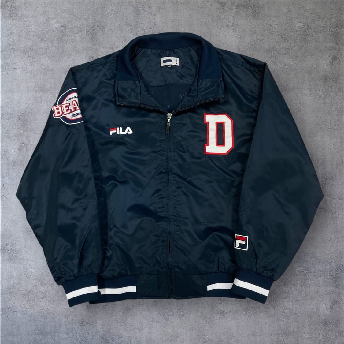 휠라 두산 베어스 네이비 컬러 스타디움 바시티 자켓 상품이미지1