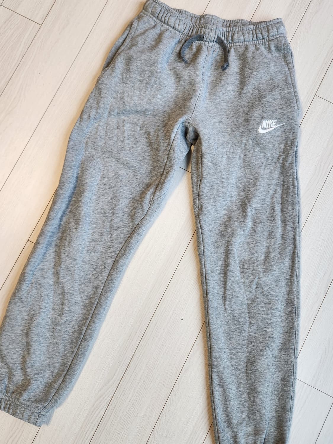 나이키 나이키 NSW 기모 팬츠 사이즈L (805494-063)

 상품이미지1