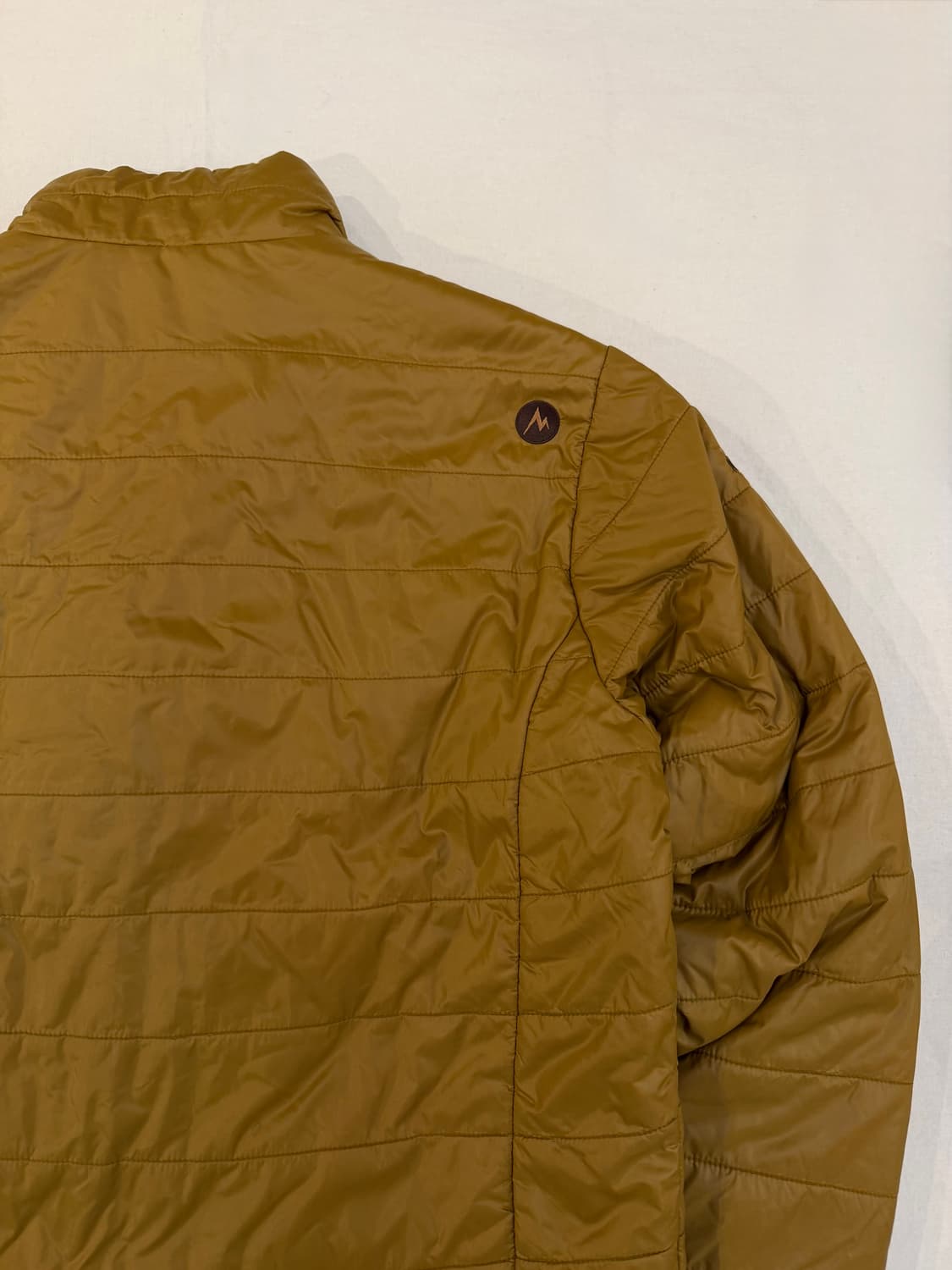 마모트 시그니쳐 로고 씬슐레이트 경량패딩 머스타드 상품이미지1