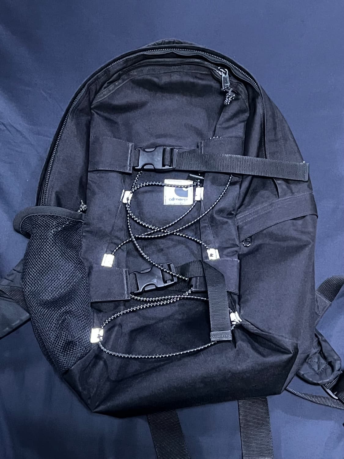 칼하트WIP 리플렉티브 킥플립 백팩 상품이미지1